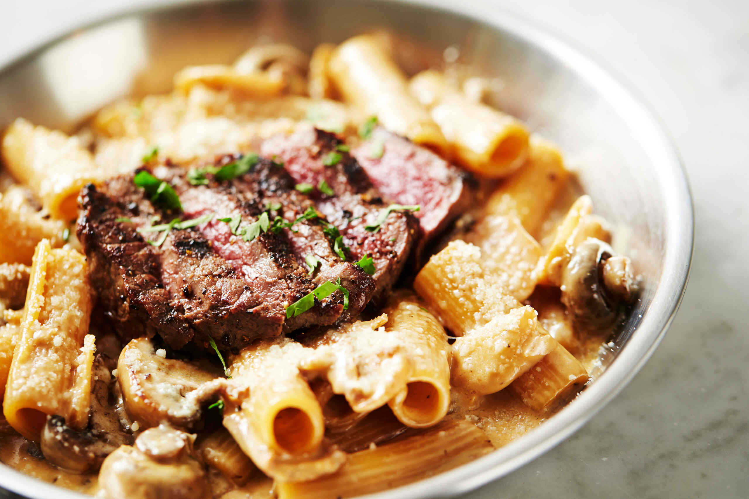 Steak rigatoni in creamy parmesan sauce